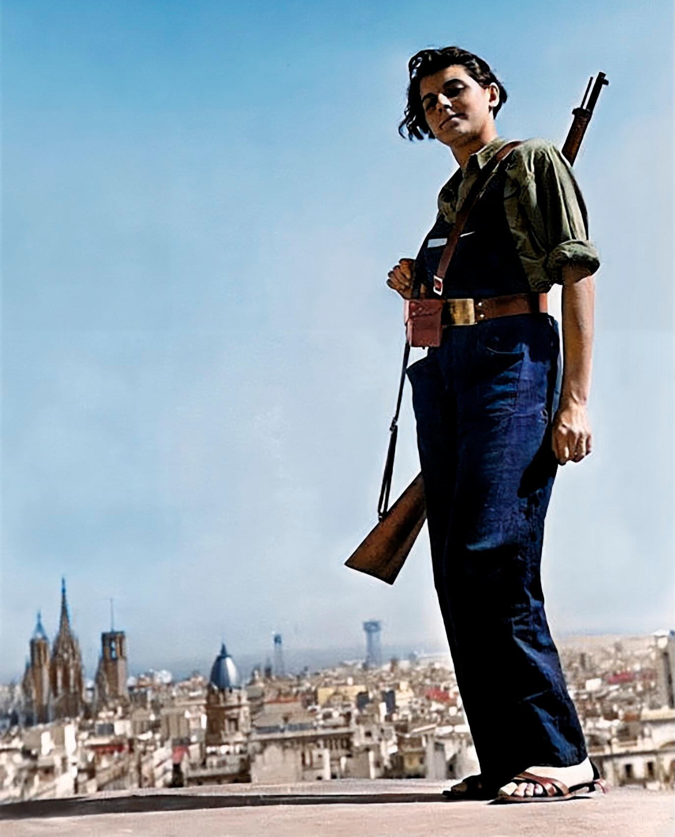 Colorized image of Marina Ginestà stadning on the rooftop of the Hotel Colón in Barcelona, expropriated by the revolutionaries.